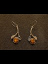Earrings in silver with polished amber